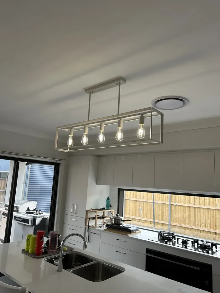 Modern kitchen with pendant lights and island sink