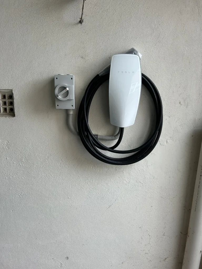 Tesla wall charger mounted on wall