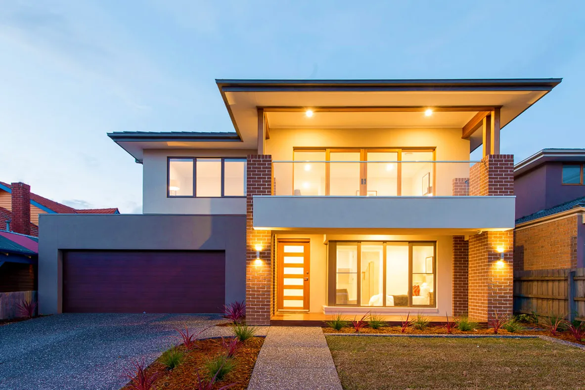 Modern two-story house at dusk.
